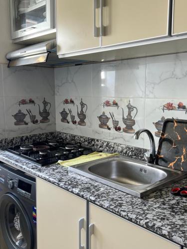 Η κουζίνα ή μικρή κουζίνα στο Cosy chambre salon à 2 min harhoura