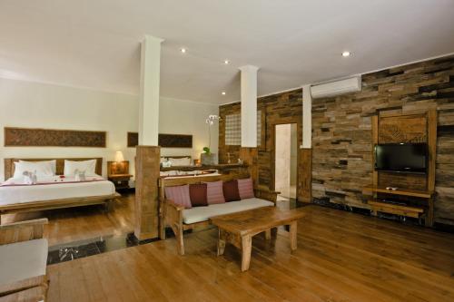 Postel nebo postele na pokoji v ubytování Sri Ratih Cottages, CHSE Certified