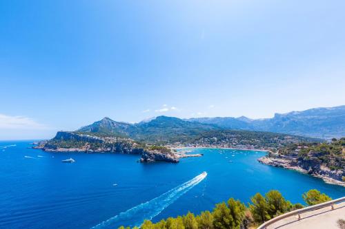 a view of a bay with boats in the water at Es Mercat in Sóller