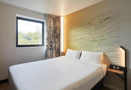 Postel nebo postele na pokoji v ubytování B&B HOTEL Paris Rosny-sous-Bois