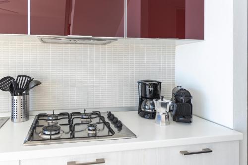 a kitchen counter top with a stove top oven at Il Giardino Di Lory in Vercana