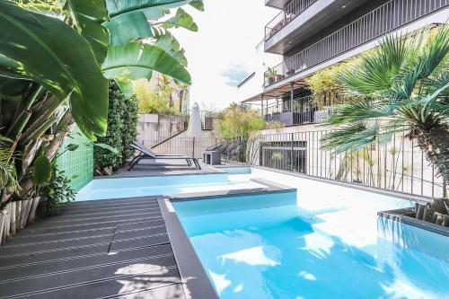 a swimming pool in the middle of a building at Alcantara Lovely With Balcony 2 Bdr Apt with AC in Lisbon