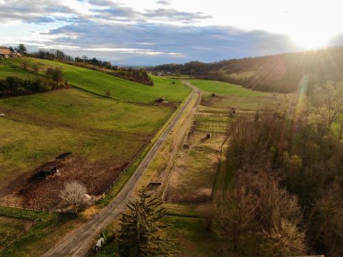 an aerial view of a road in a field at Origine Country Farm in Tabiano