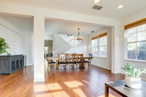 a dining room and living room with a table and chairs at 4 Mi to UC Davis Updated Family Home! in Davis