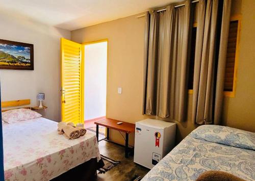 Postel nebo postele na pokoji v ubytování Atelier & Pousada Chapada