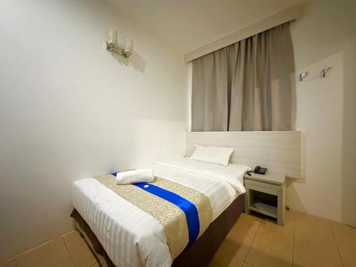 Ένα ή περισσότερα κρεβάτια σε δωμάτιο στο Park Hotel
