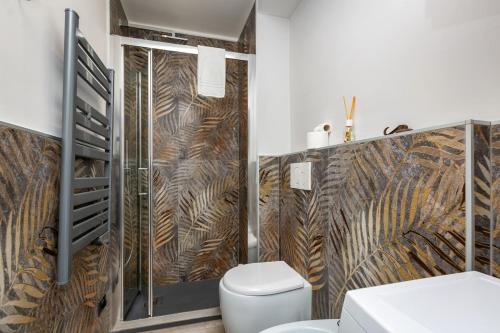 a bathroom with a shower and a toilet in it at In Piccolo in Turin