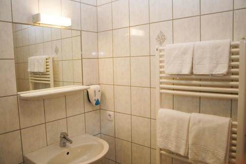Koupelna v ubytování G&K Hotel