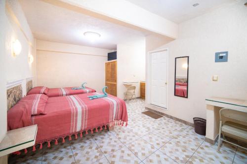 Katil atau katil-katil dalam bilik di HOTEL PENÍNSULA Salina Cruz