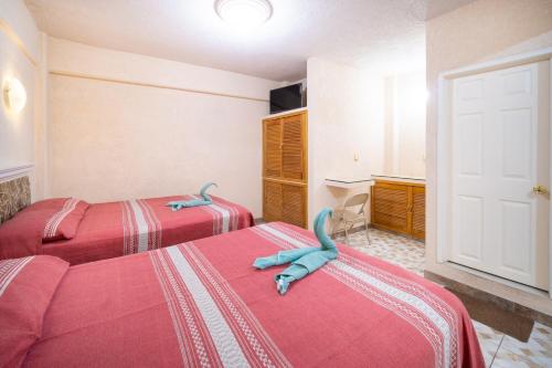 Katil atau katil-katil dalam bilik di HOTEL PENÍNSULA Salina Cruz
