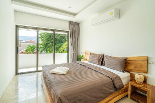 Ένα ή περισσότερα κρεβάτια σε δωμάτιο στο Villa Traventine Chaweng Noi