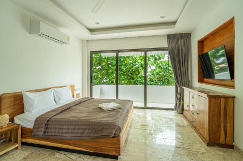 Ένα ή περισσότερα κρεβάτια σε δωμάτιο στο Villa Traventine Chaweng Noi