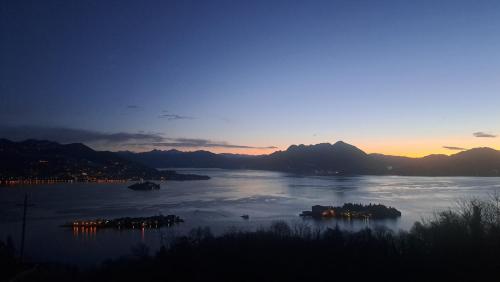 a view of a body of water at sunset at Shambala Home Casa Luna in Someraro