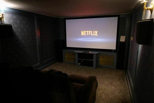 a living room with a flat screen tv in a room at Private Country Residence Made 4 Luxury Gathering in Newcastle West