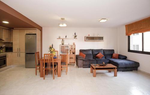 a living room with a couch and a table at Beautiful Apartment In Pineda De Mar in Pineda de Mar