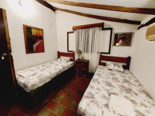 Кровать или кровати в номере Rancho los Alpes