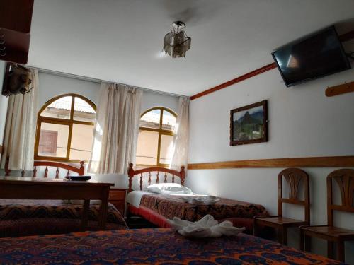 Katil atau katil-katil dalam bilik di Hostal Turístico Alborada