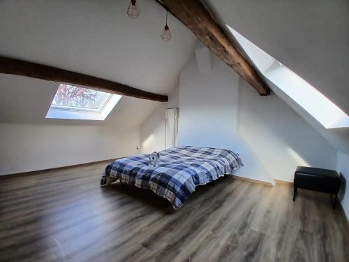 a bedroom with a bed in a attic at Cosy homestay in Quiet historic area in Tienen