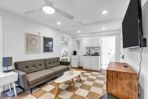 a living room with a couch and a table at The Central Ave House in Ocean Grove