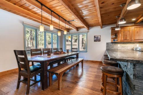 a dining room with a wooden table and chairs at Tahoe Dreamer by Tahoe Getaways - Pet Friendly 4 BR Gated Home w Fenced Yard, Game Room & Walk to Lake! in Carnelian Bay