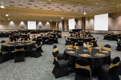 a large banquet hall with tables and chairs at Sonesta Essential Junction City in Junction City