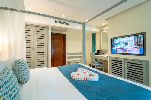 Postel nebo postele na pokoji v ubytování Baobab Beach Resort & Spa