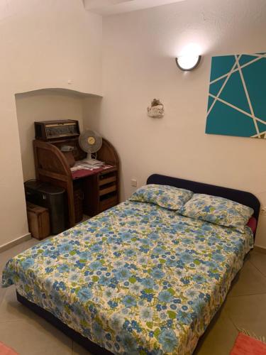 a bedroom with a bed and a desk in it at Lili Apartments, Sv Dunata 18 in Krk