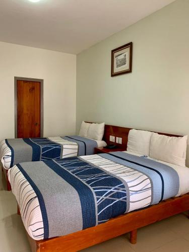 Una cama o camas en una habitación de HOTEL POSADA DEL SOL