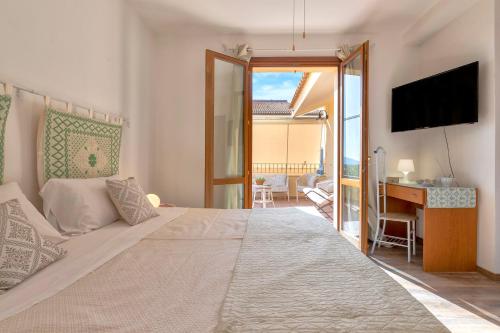 Posteľ alebo postele v izbe v ubytovaní Sardinia Guest House