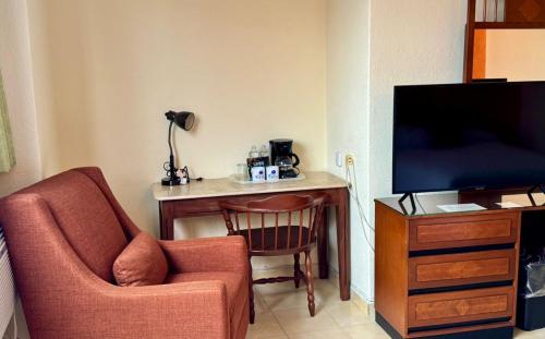 TV a/nebo společenská místnost v ubytování Hotel Bello Cordoba