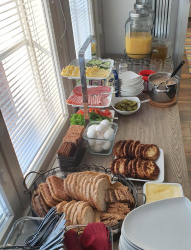 a table topped with lots of different types of food at Majatalo Elsa in Hirvihaara