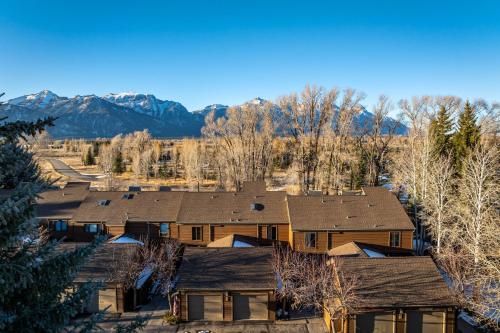 an aerial view of a home with mountains in the background at Wister C in Teton Village