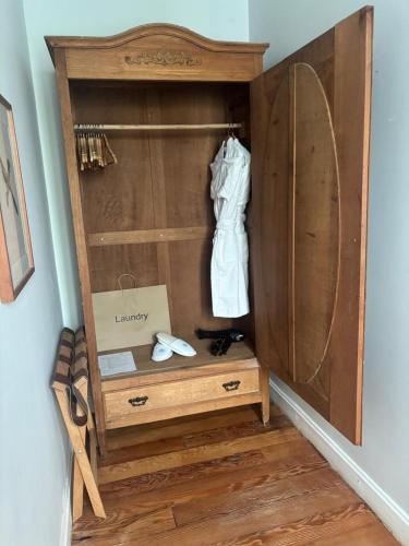 a wooden closet with a dresser in a room at Villa Barranco by Ananay Hotels in Lima