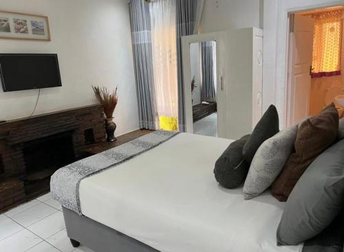 En eller flere senge i et værelse på Manshu Guesthouse