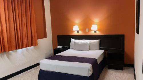 Ένα ή περισσότερα κρεβάτια σε δωμάτιο στο HOTEL ValgrandE