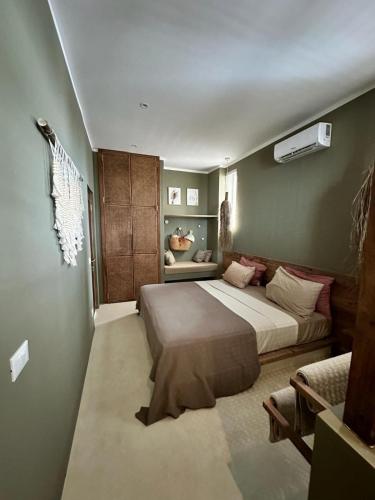 a bedroom with a large bed in a room at Bahari View, Stylish Penthouse with breathtaking oceanviews and private rooftop pool in Kiwengwa