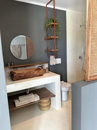 a bathroom with a white sink and a mirror at Bahari View, Stylish Penthouse with breathtaking oceanviews and private rooftop pool in Kiwengwa