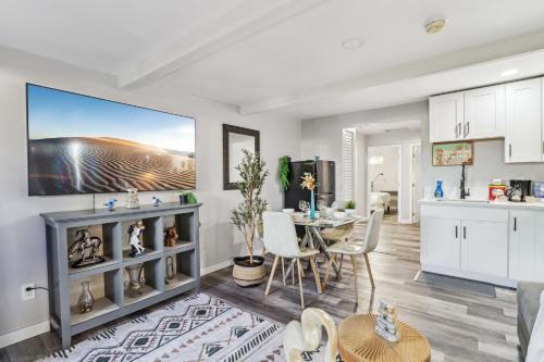 a kitchen and living room with a table and chairs at Entire Private 2-Bedroom Home w Gated Yard, Driveway Parking, Available Now in Spring Valley