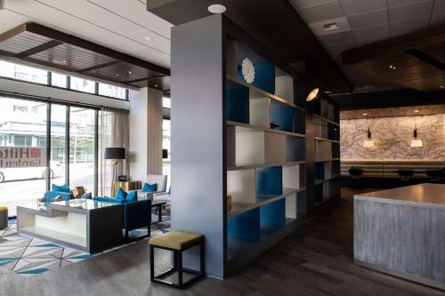 an office lobby with a wall of shelves at Hilton Garden Inn Redmond WA in Redmond