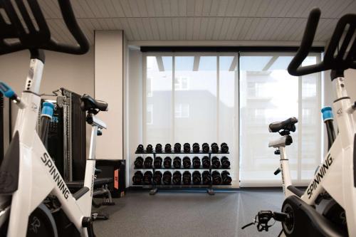 a gym with a bunch of exercise bikes in it at Hilton Garden Inn Redmond WA in Redmond