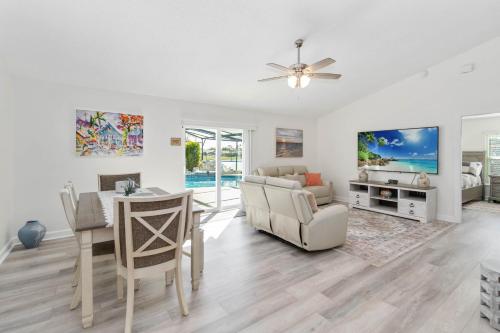 a living room with a table and a dining room at Debany Staycation near Disney in Kissimmee