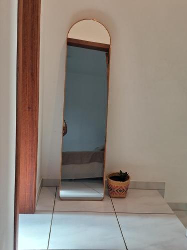 a mirror sitting on the floor in a room at Lar Suave Lar in Florianópolis