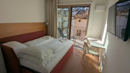 Postel nebo postele na pokoji v ubytování Wellness Smart Suites