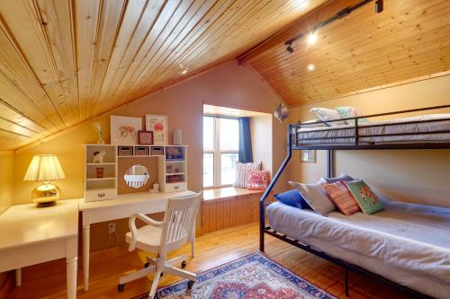 a bedroom with a bunk bed and a desk and a deskablish at Private Hot Tub and Pickleball Court Baird Home! in Baird