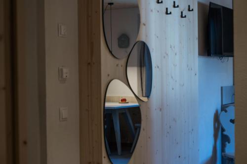 a mirror on a wall in a room at Ansitz Pontegardena in Ponte Gardena