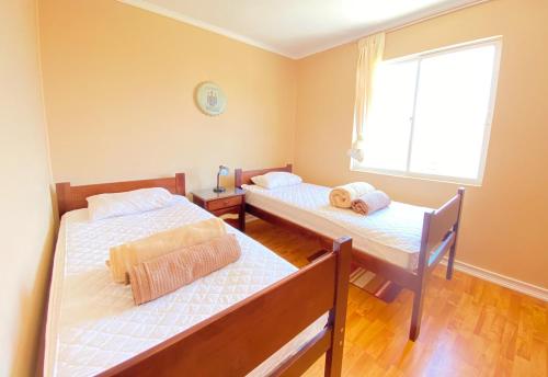 Postel nebo postele na pokoji v ubytování Casa Veraneo en Los Molles Nº1 a 8 mins de la playa