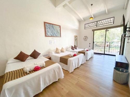 Postel nebo postele na pokoji v ubytování Punta del Cielo Tepoztlán