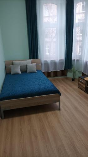 Postel nebo postele na pokoji v ubytování apartament Oscar