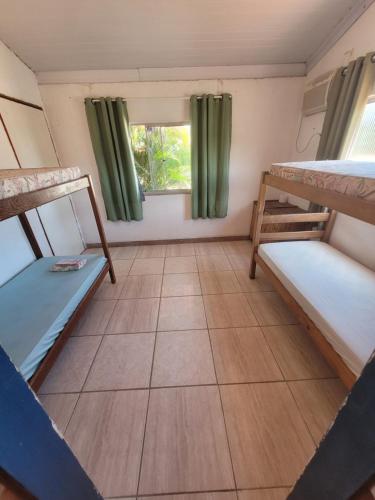 Postel nebo postele na pokoji v ubytování Hostel Tabapiri