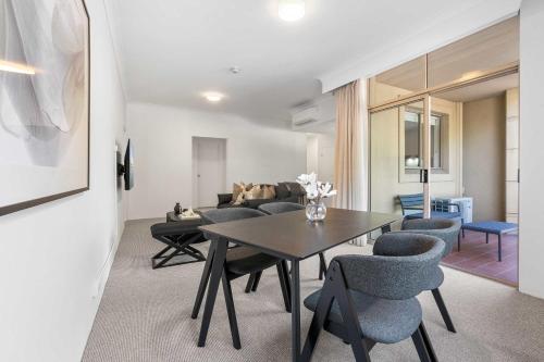 a living room with a table and chairs at Camperdown Cozy Corner 1 in Sydney
